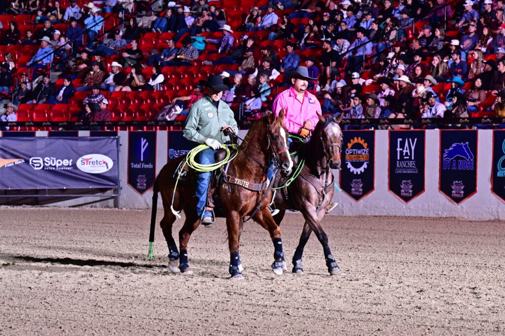 The header and heeler in a team roping event.